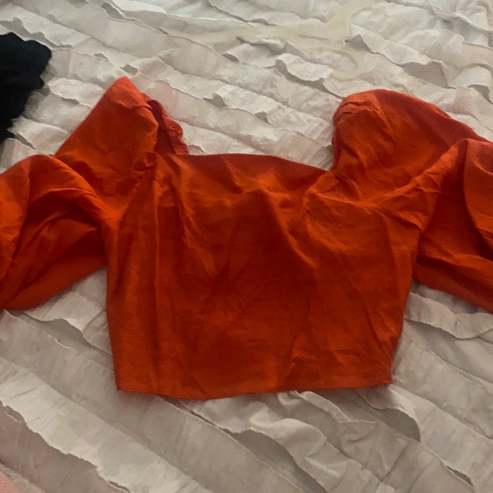 Orange top size medium. Never worn